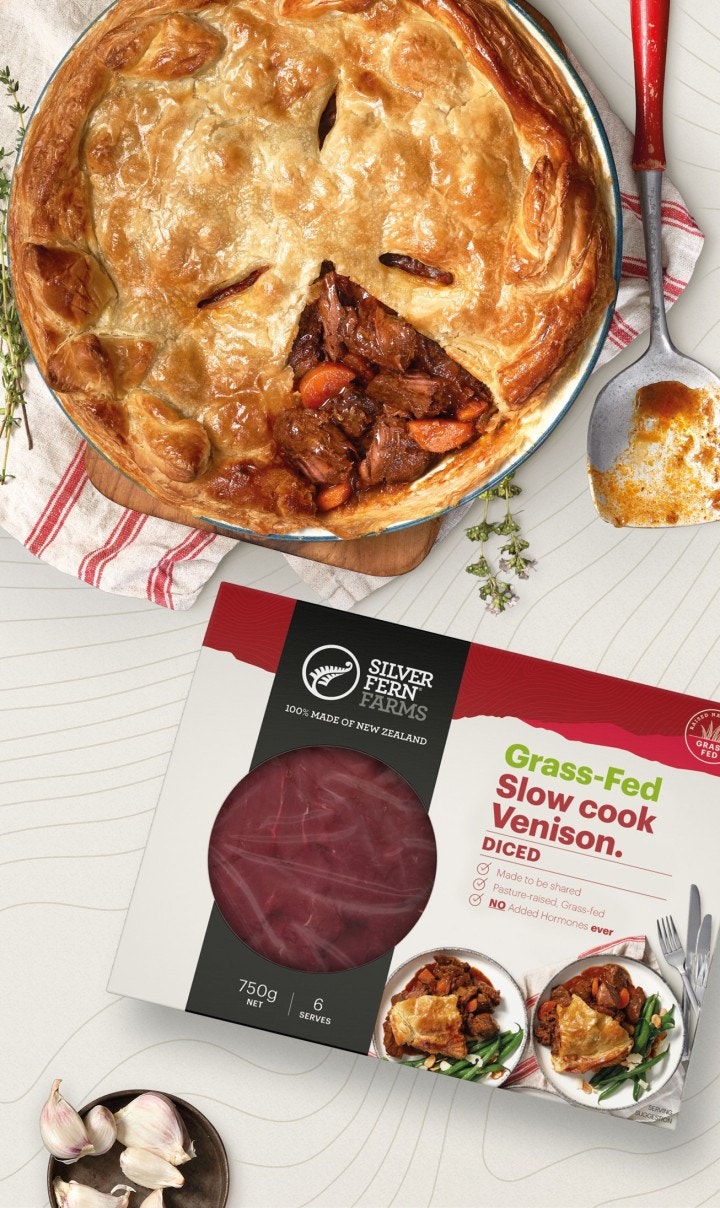 a venison pie sitting next to a package of grass-fed slow cook venison diced