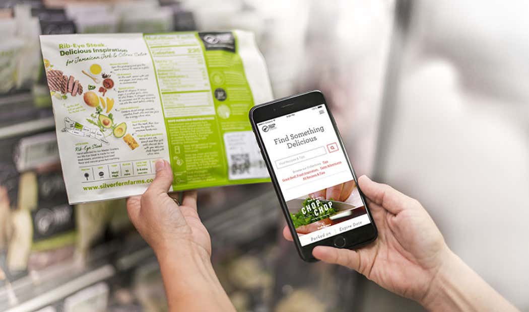 USA retail pack with visible QR code held by a person holding their phone