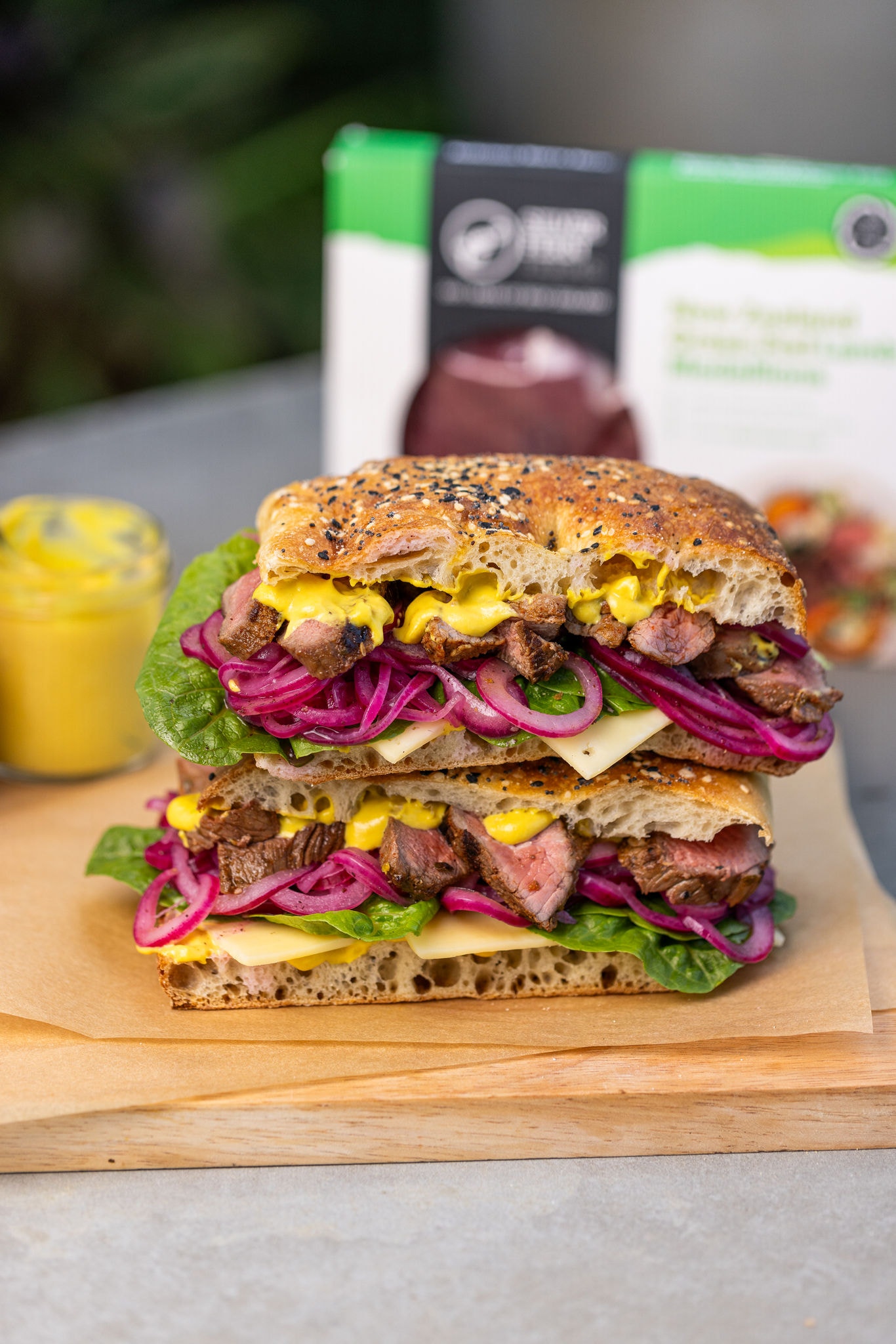 Marinated Lamb Medallion Sandwich with Pickled Red Onions and Mustard Dressing