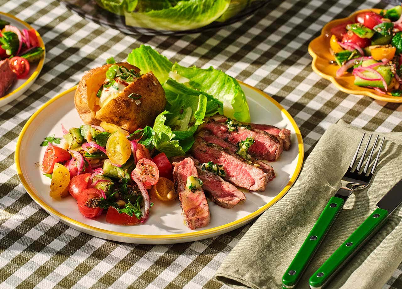 BBQ Top Sirloin Steaks with Baked Potatoes and Tomato Pine Nut Salad