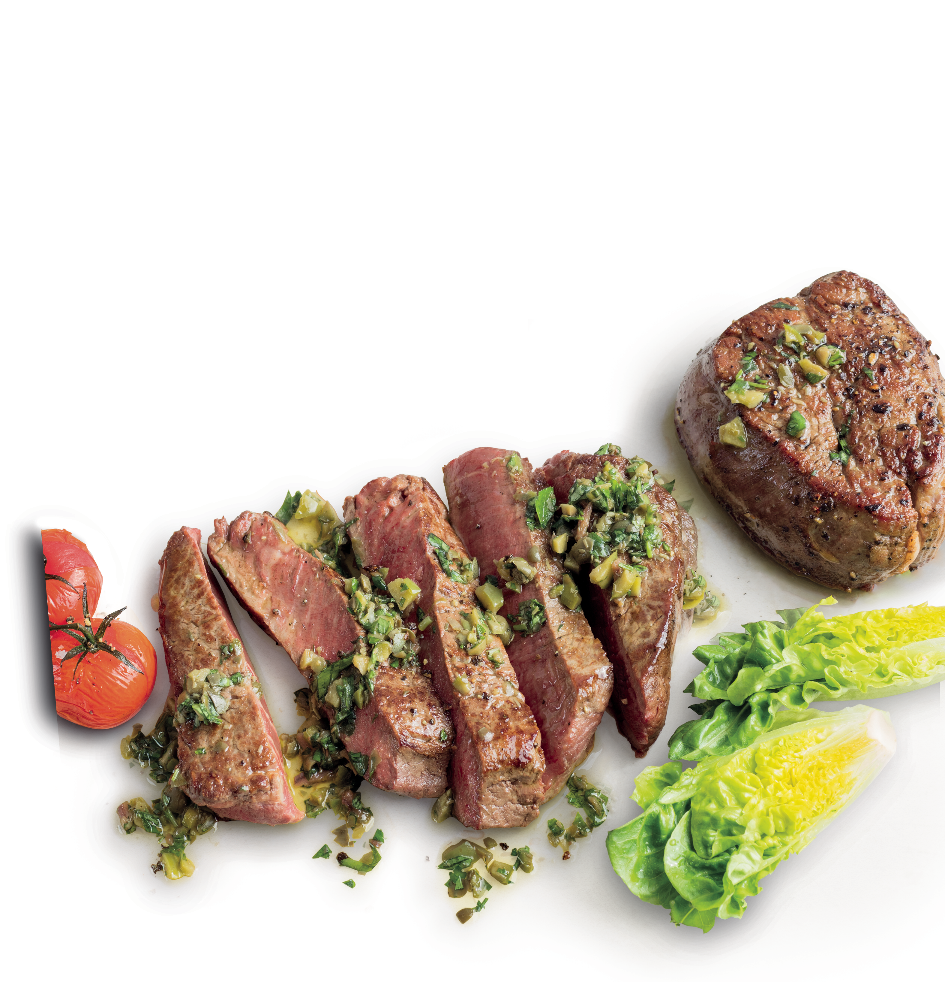 Beef Eye Fillet Steaks with Mediterranean Salsa, Cherry Tomatoes and Baby Potatoes next to lettuce