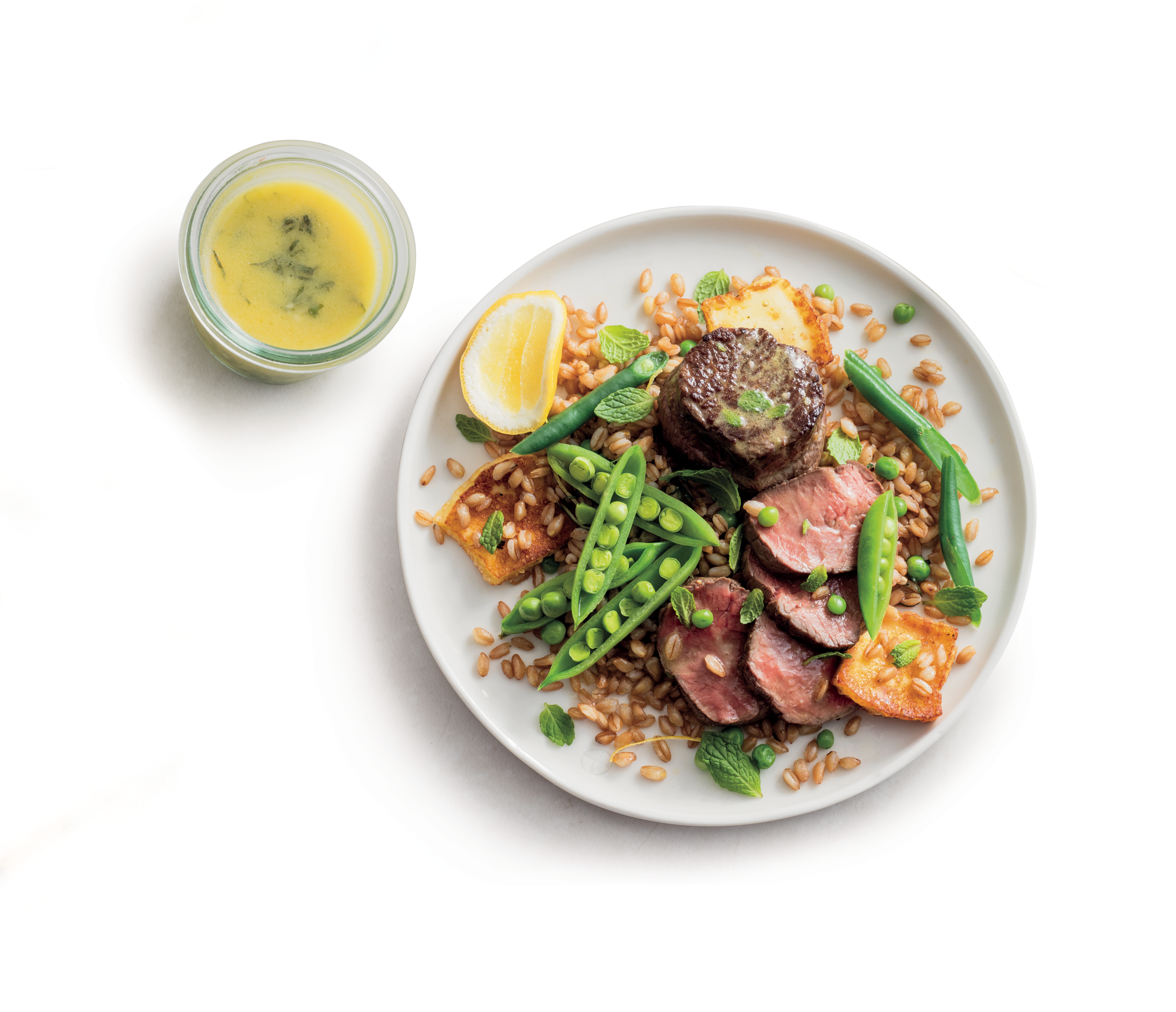 Beef Medallions with Zesty Grain Salad on a white plate 