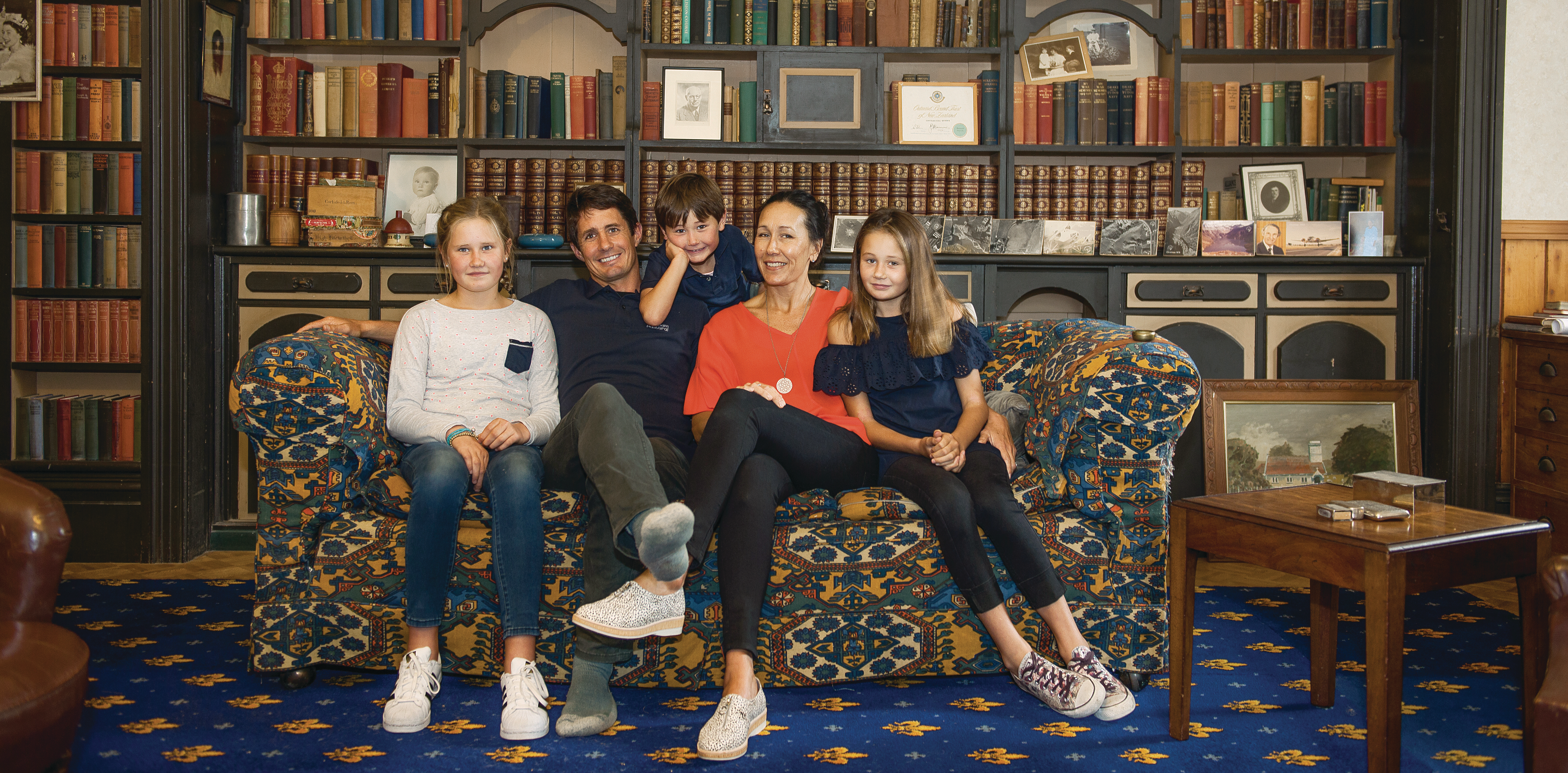 the beethams sitting on a couch