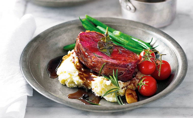 Juniper-Marinated Venison Roast on a grey plate