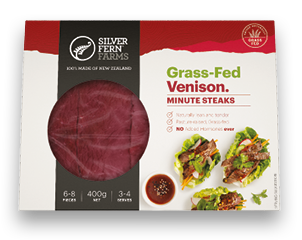 grass-fed venison minute steaks packaging on an illustrated background of red hills