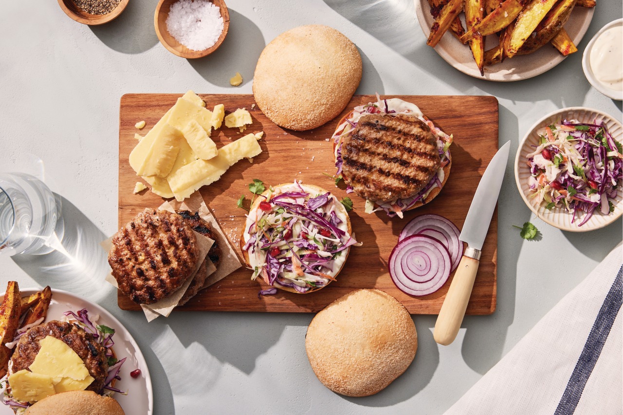 Pure Burgers: Lamb Rump Burger being assembled on a wooden board