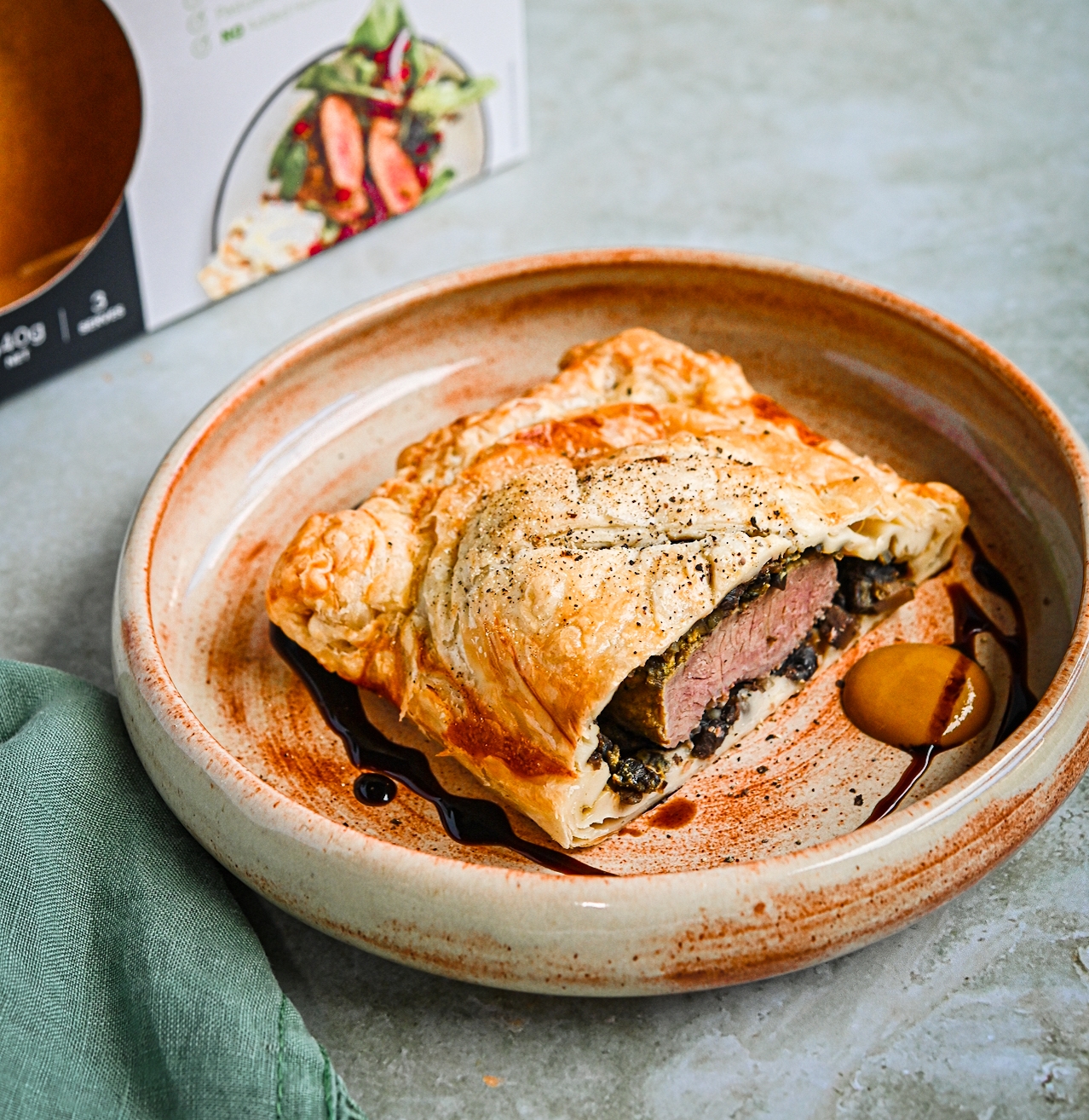 lamb wellington with mushroom & mustard in a bowl