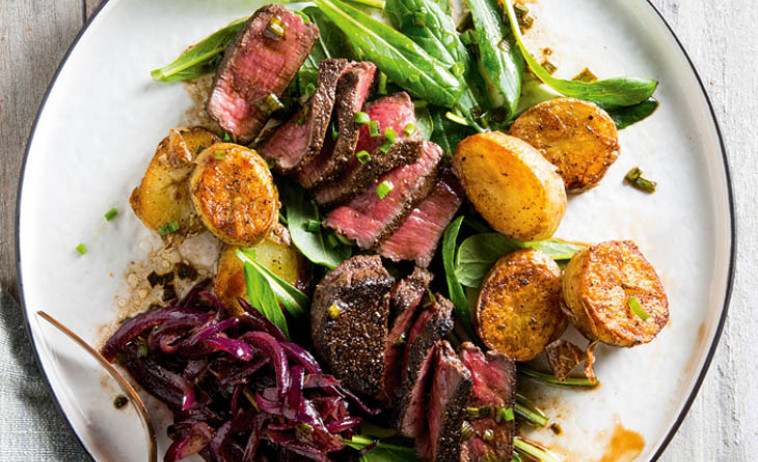 Venison Salad with Raspberry Vinaigrette on a white plate