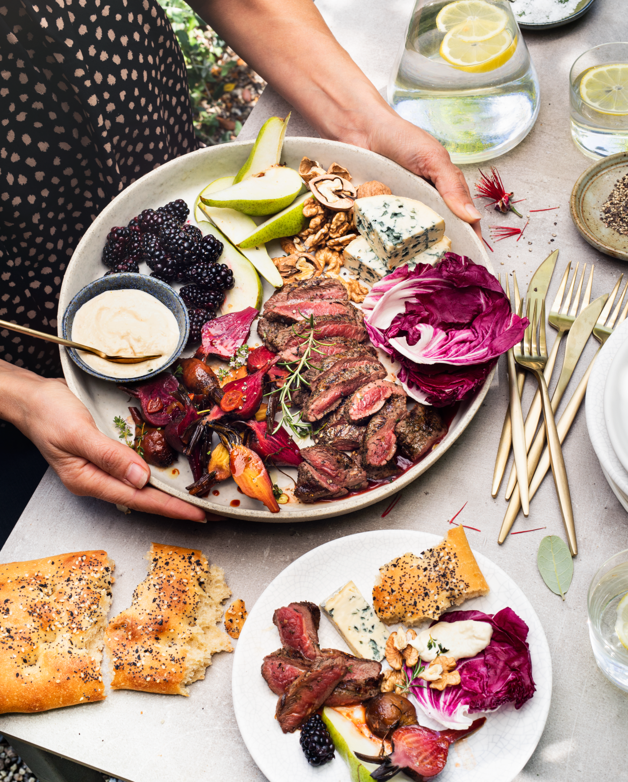 Venison Steak Sharing Platter on a plate being held