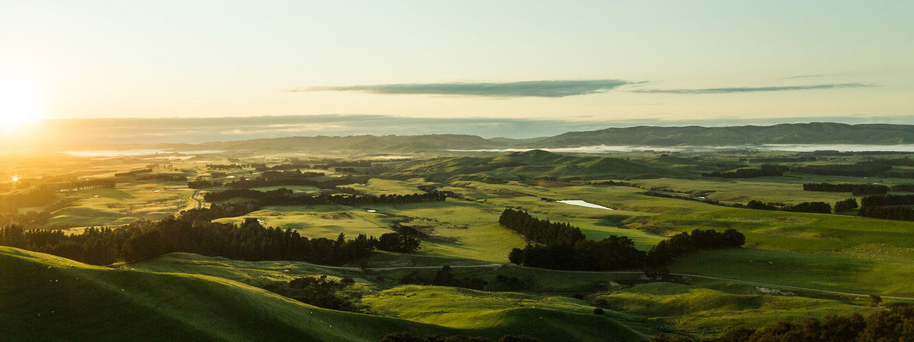 Farm landscape with sun rising