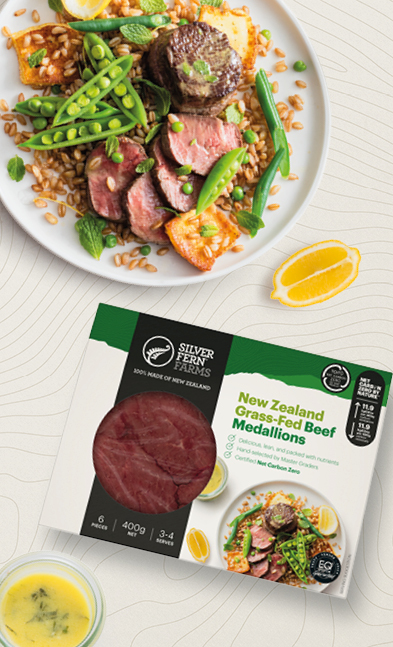 beef medallion salad next to a lemon wedge and a package of grass-fed beef medallions