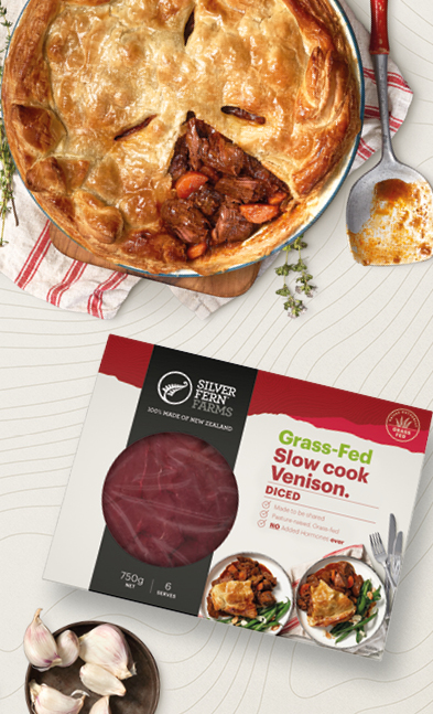 a venison pie sitting next to a package of grass-fed slow cook venison diced