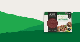 grass-fed beef eye fillet steaks packaging on an illustrated background of green hills