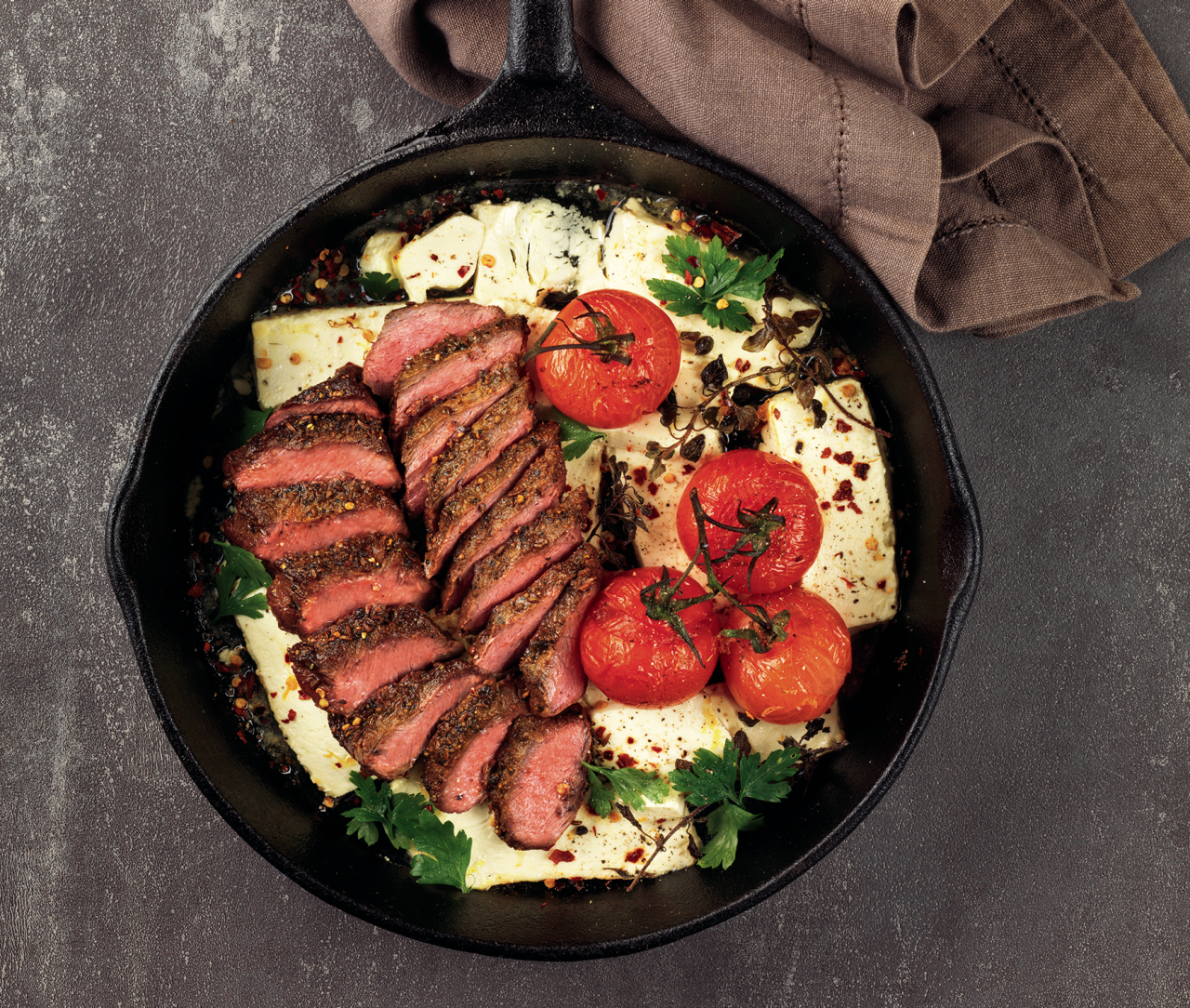 Beef Flat Iron Steaks with Middle Eastern Rub in a cast iron pan
