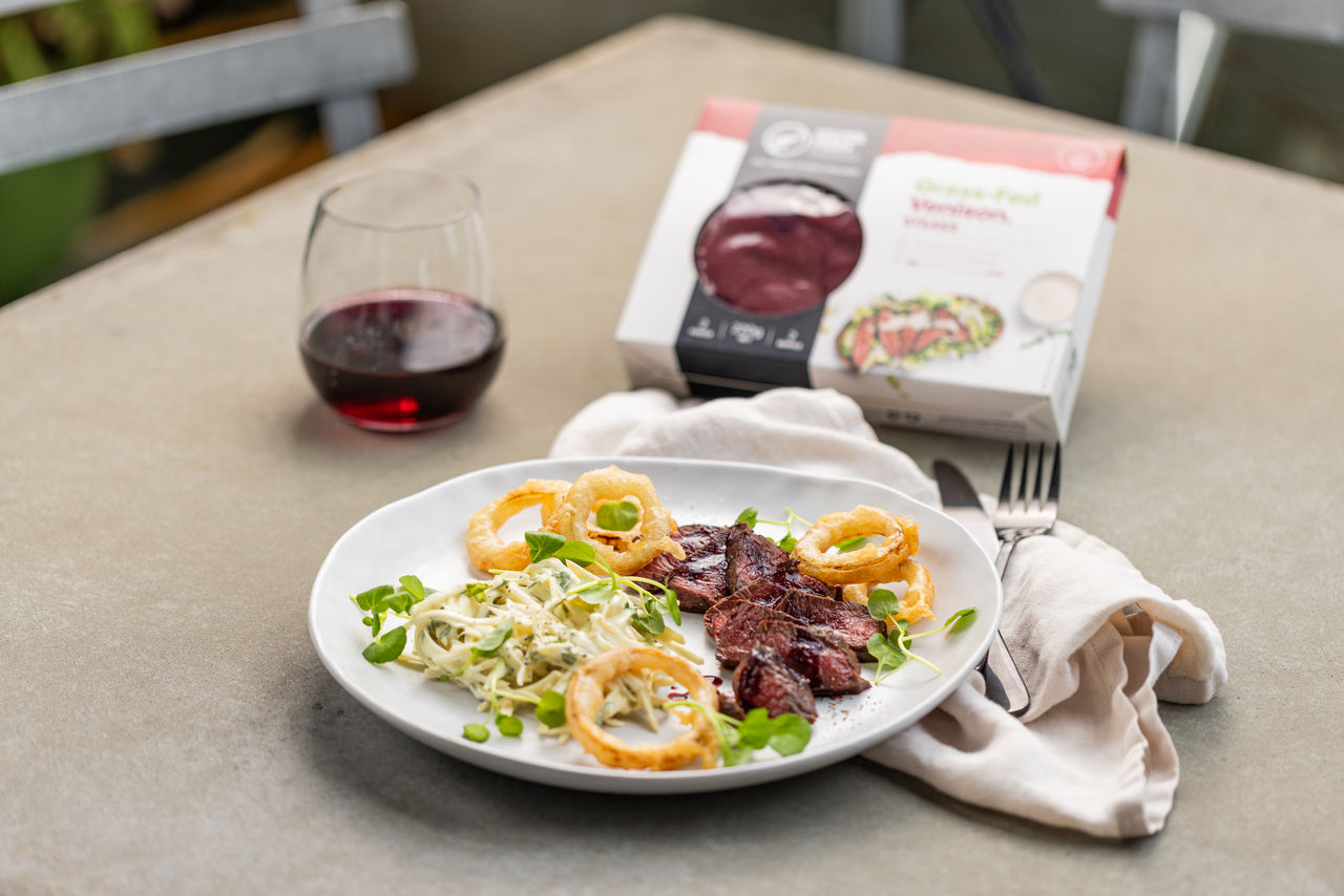 Berry Glazed Venison Steak with Beer Battered Onions and Celeriac Remoulade