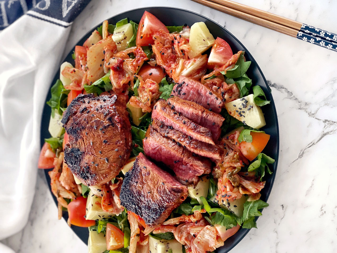 Gochujang Beef Eye Fillet Steaks with Kimchi, Tomato, Kiwifruit, & Rocket Salad