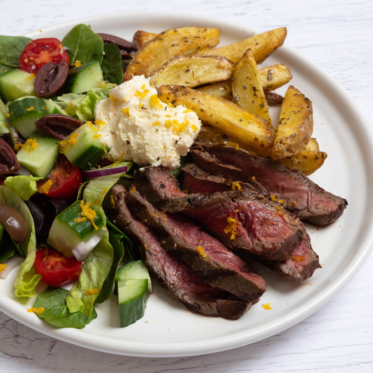 Greek Style Flat Iron Steaks with Oregano Potatoes and Whipped Feta