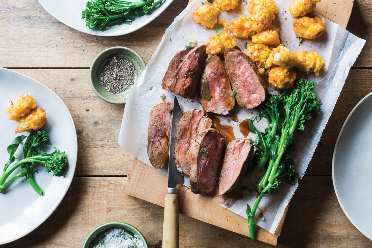 Juicy Lamb Rumps with Corn and Feta Fritters with a knife