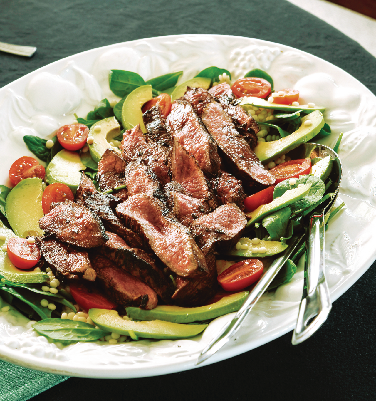 Rosemary and Balsamic Lamb Steaks on top of a salad