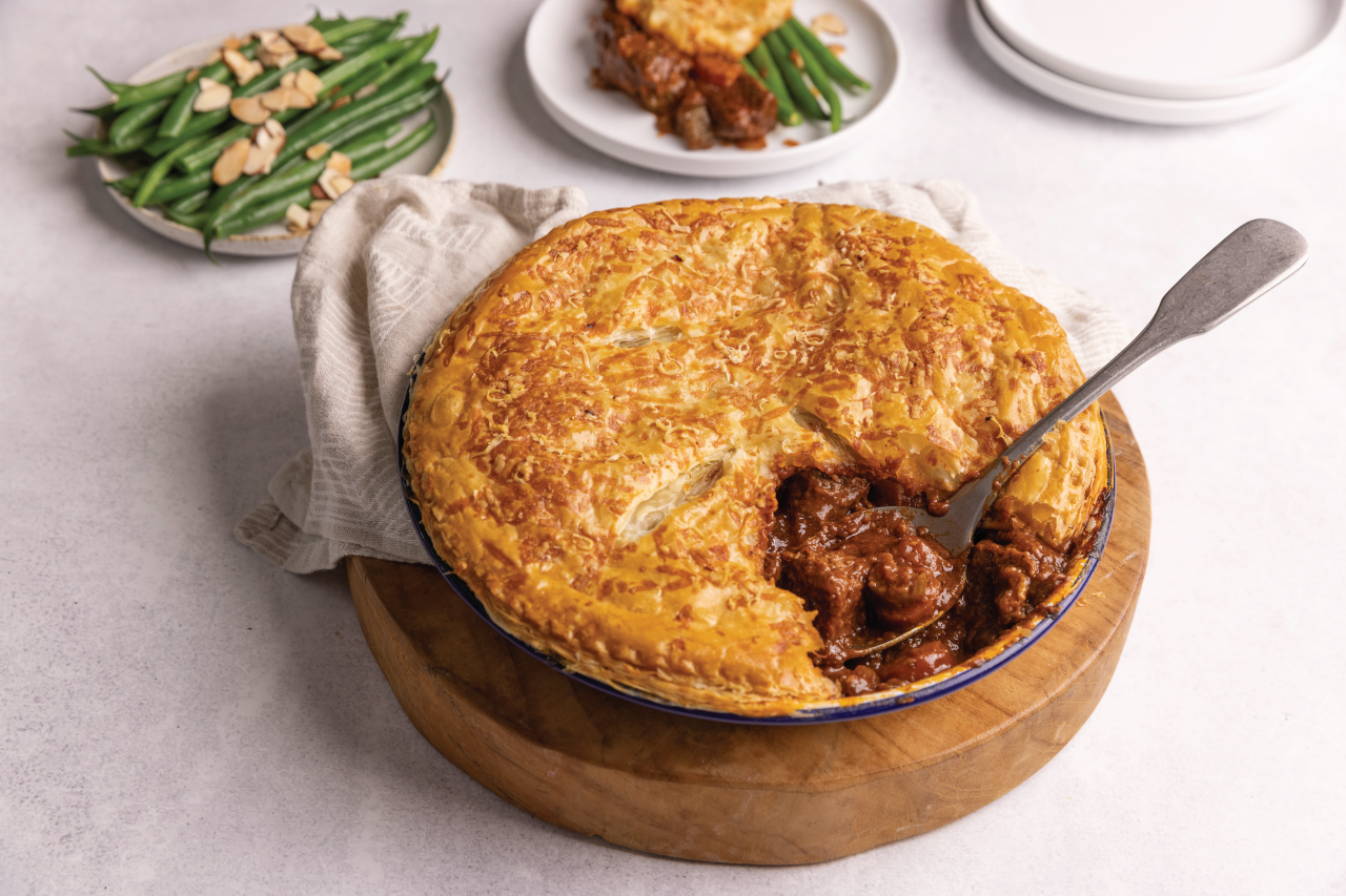 Venison and Stout Pot Pie with green beans and slithered almonds on the side