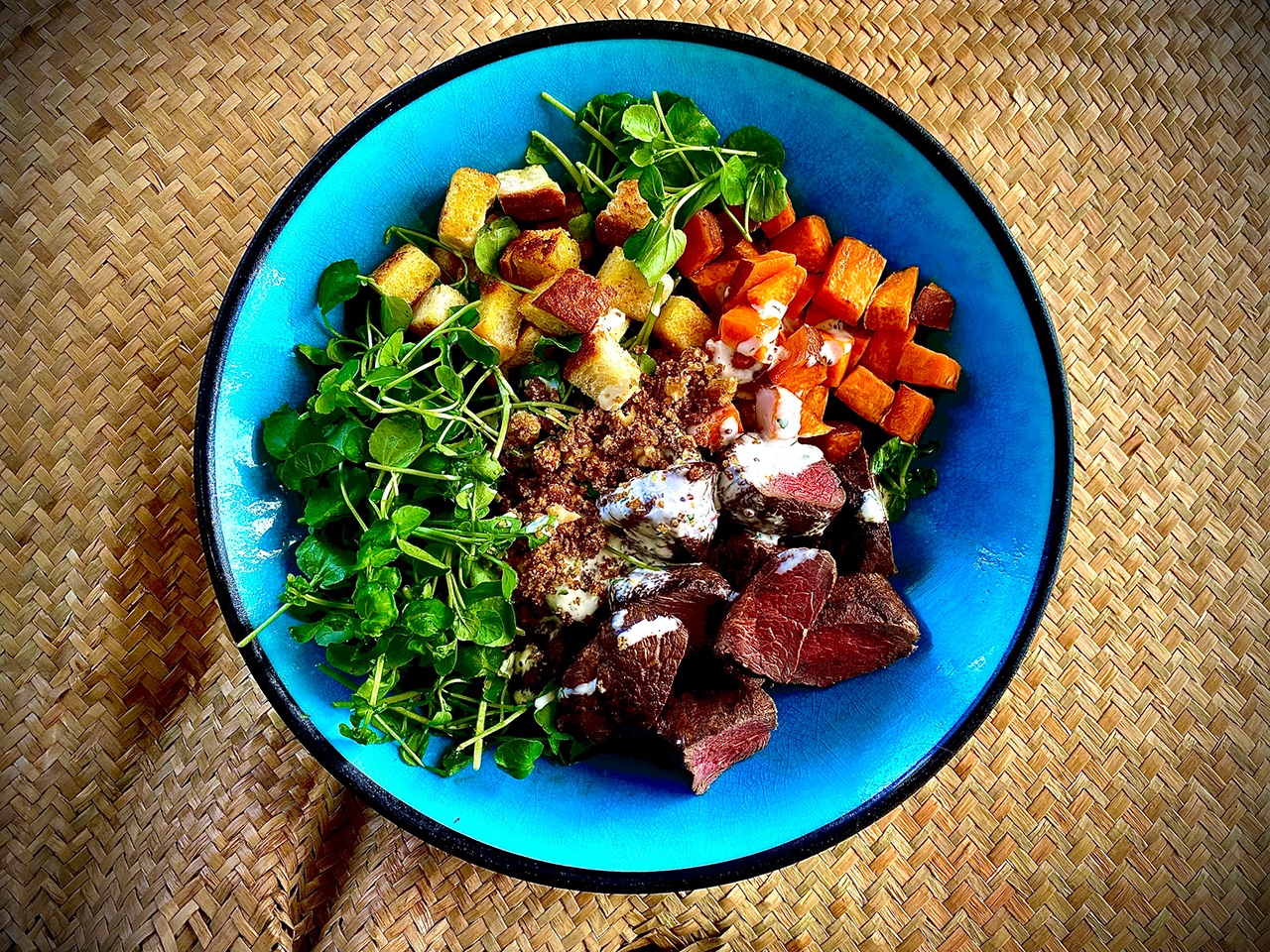 Venison Medallions and Watercress Salad with Rewena Croutons and Kawakawa Dressing
