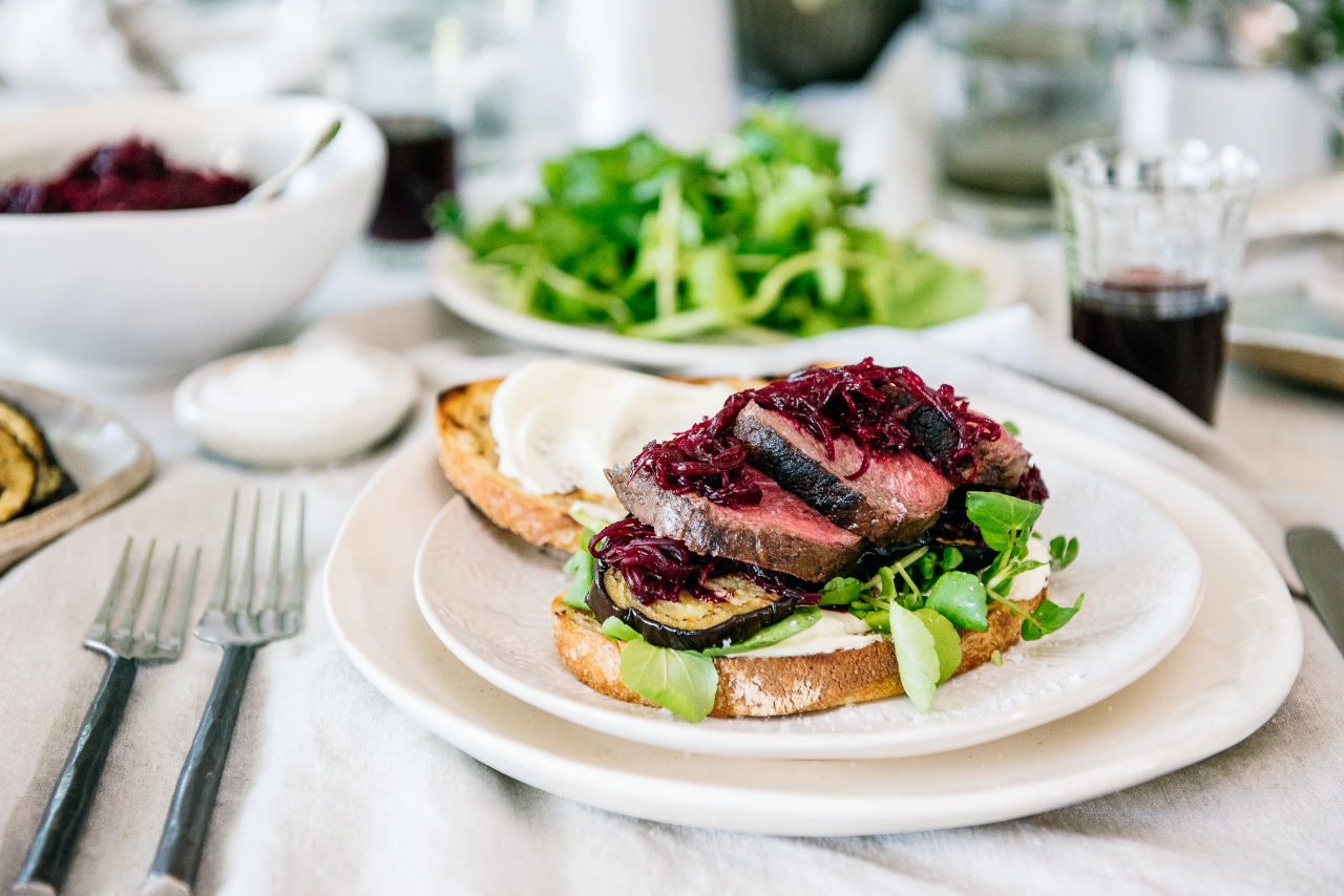 Venison Roast Sandwiches with Feta, Grilled Eggplant and Beetroot Relish on a white plate