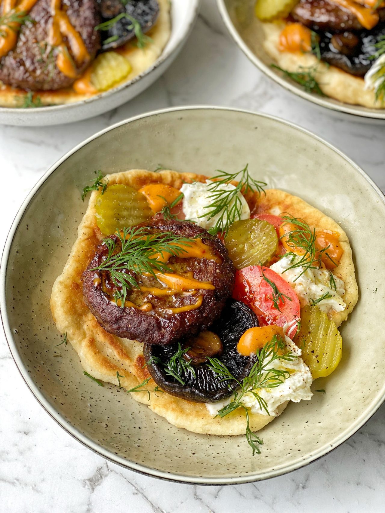 Yoghurt Flatbread Lamb Burgers with Portobello Mushroom, Buffalo Mozzarella, Tomatoes, and Gherkins
