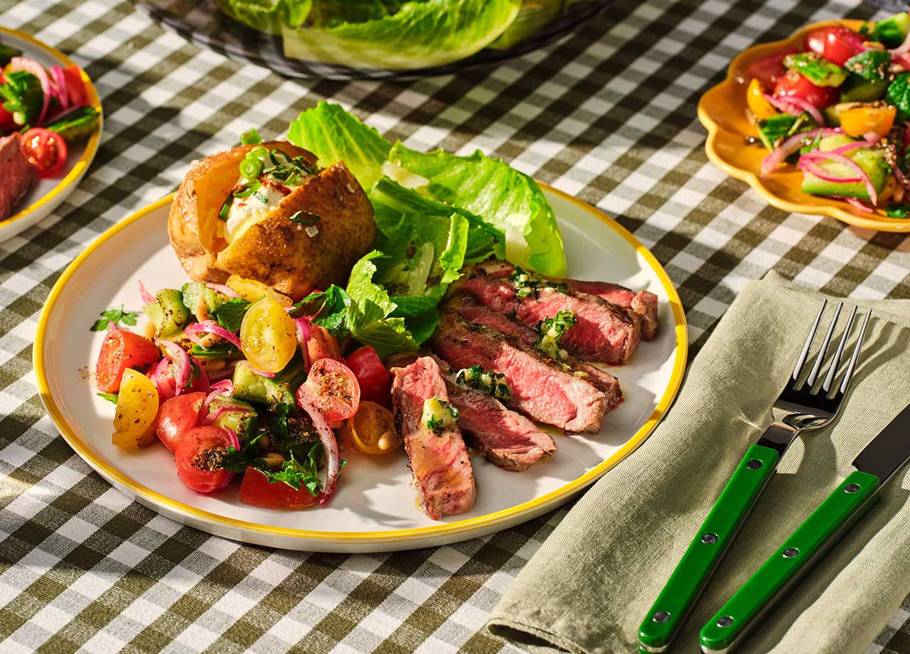 BBQ Top Sirloin Steaks with Baked Potatoes and Tomato Pine Nut Salad